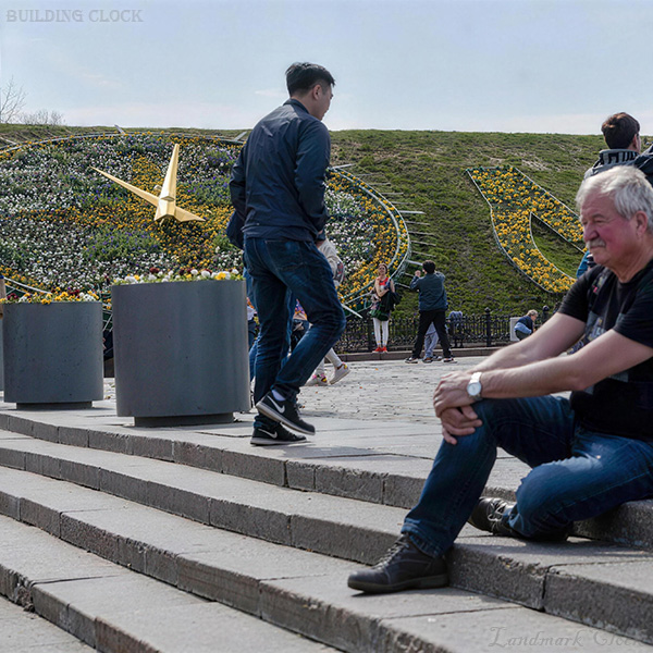Large floral clock with perimeter structure designed for hillside stability and maintenance Large floral clock with perimeter structure designed for hillside stability and maintenance